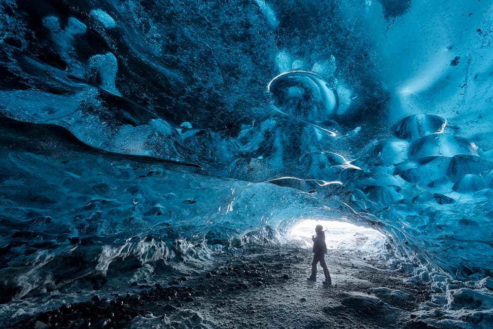 Blue Ice Cave Explorer by Rafal R. Nebelski — canvas wall art