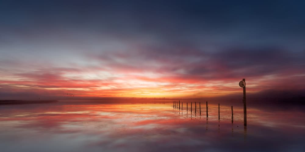 Dramatic Misty Sunrise by Leif Løndal — canvas wall art