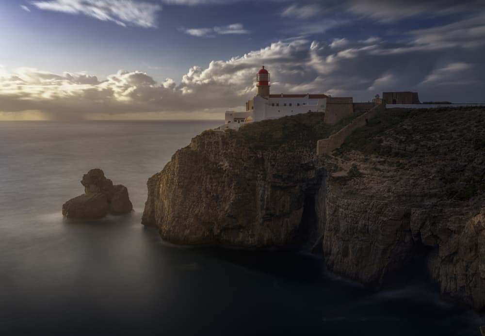 Cliffside Lighthouse Glow by Josema Martin Espinar — canvas wall art