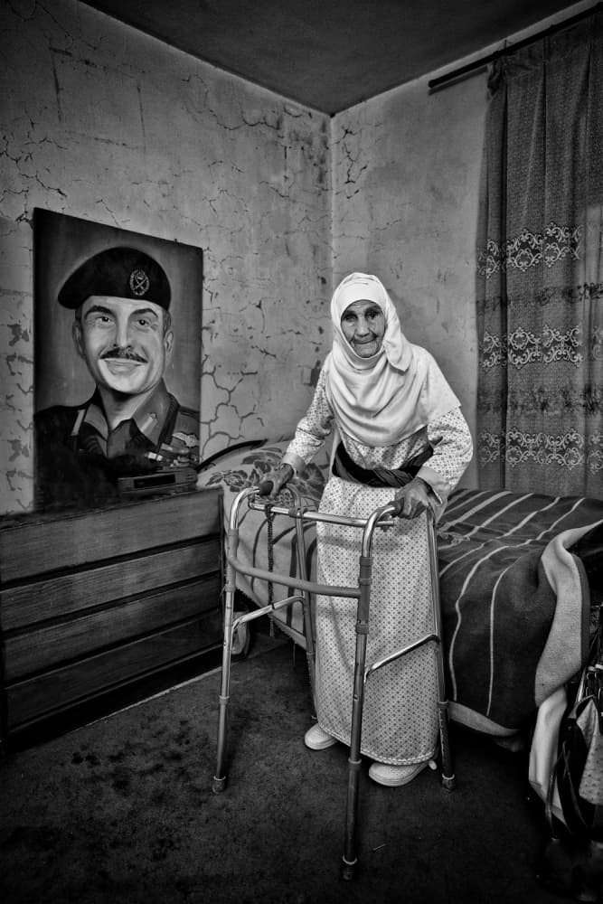 Elderly Woman Home Portrait by Rami Al Adwan — canvas wall art