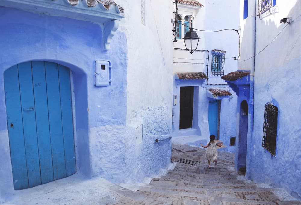 Child In Blue Alley by Giacomo Bruno — canvas wall art