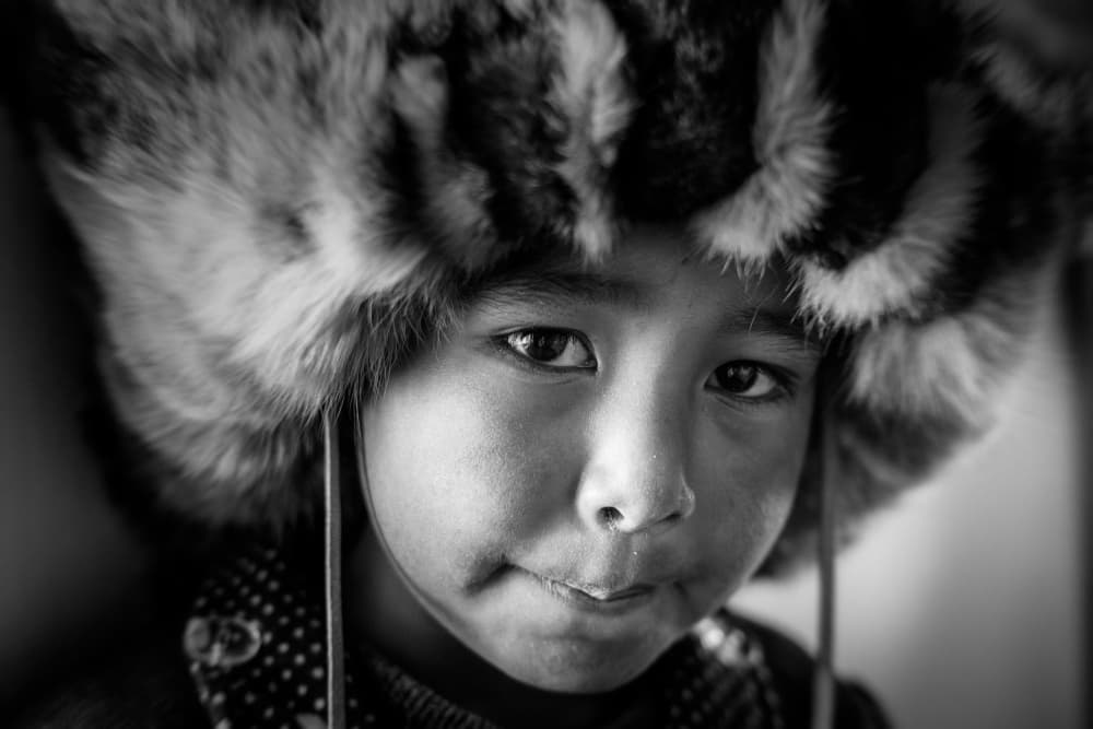 Pensive Child Fur Hat by ADIREK M — canvas wall art