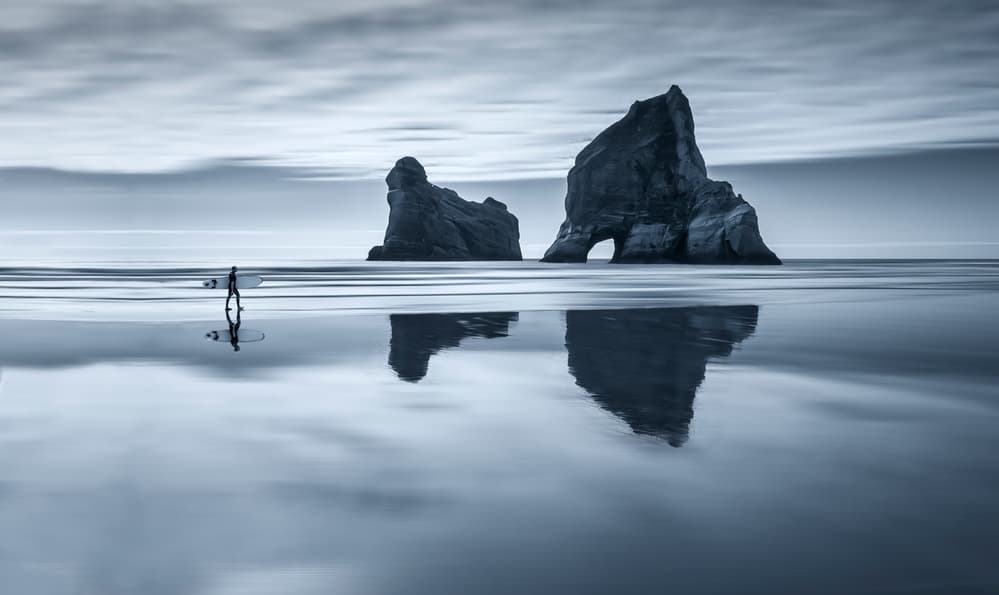 Lone Surfer Ocean Reflections by Carlos M. Almagro — canvas wall art
