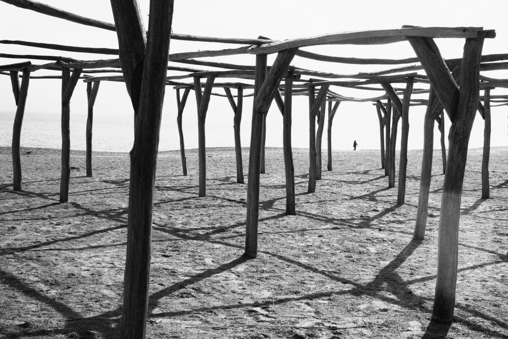 Distant Figure Beach Framework by Marius Cinteza — canvas wall art