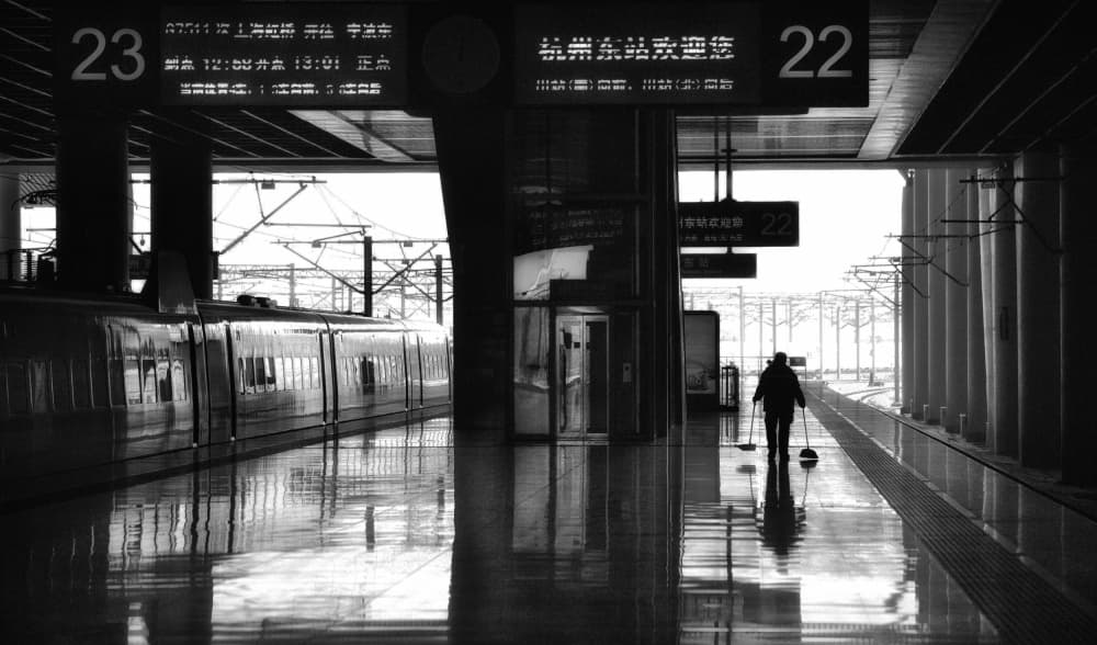 Solitary Train Platform Worker by Angela Muliani Hartojo — canvas wall art