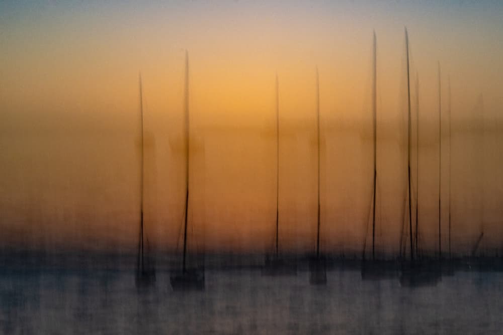 Blurred Sunset Sailboats by Franco Tessarolo — canvas wall art