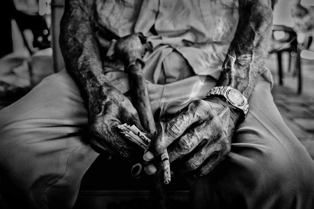Wrinkled Hands Smoking by PAUL GOMEZ — canvas wall art