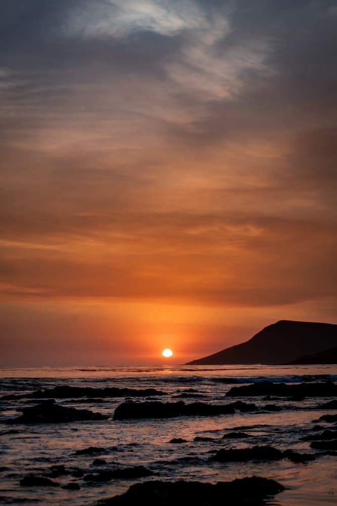 Fiery Ocean Sunset by Tim Mossholder — canvas wall art