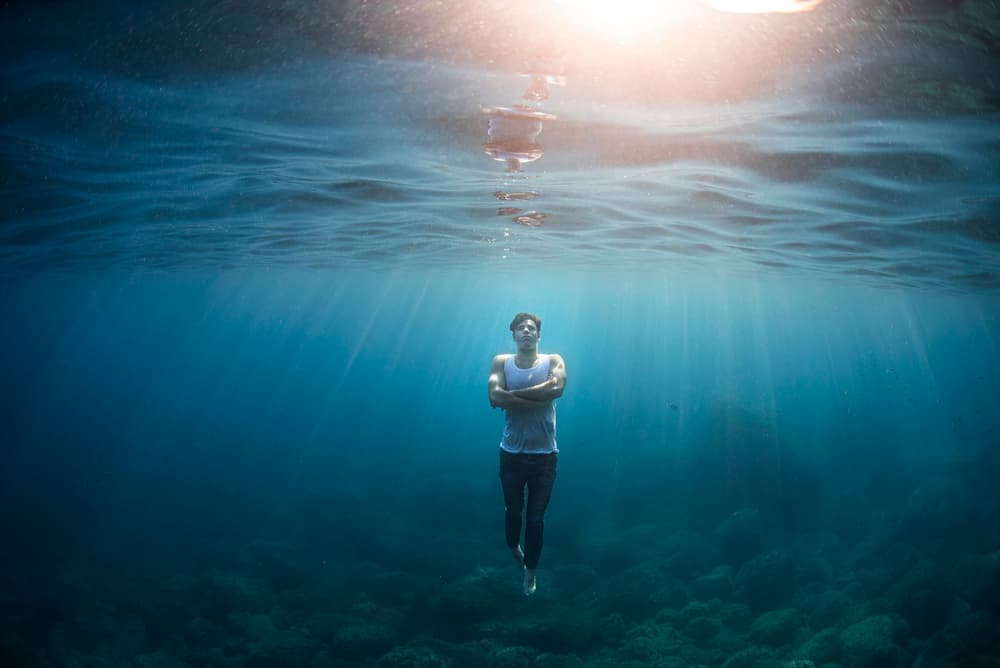 Man Underwater Sunlight by Davide Lopresti — canvas wall art