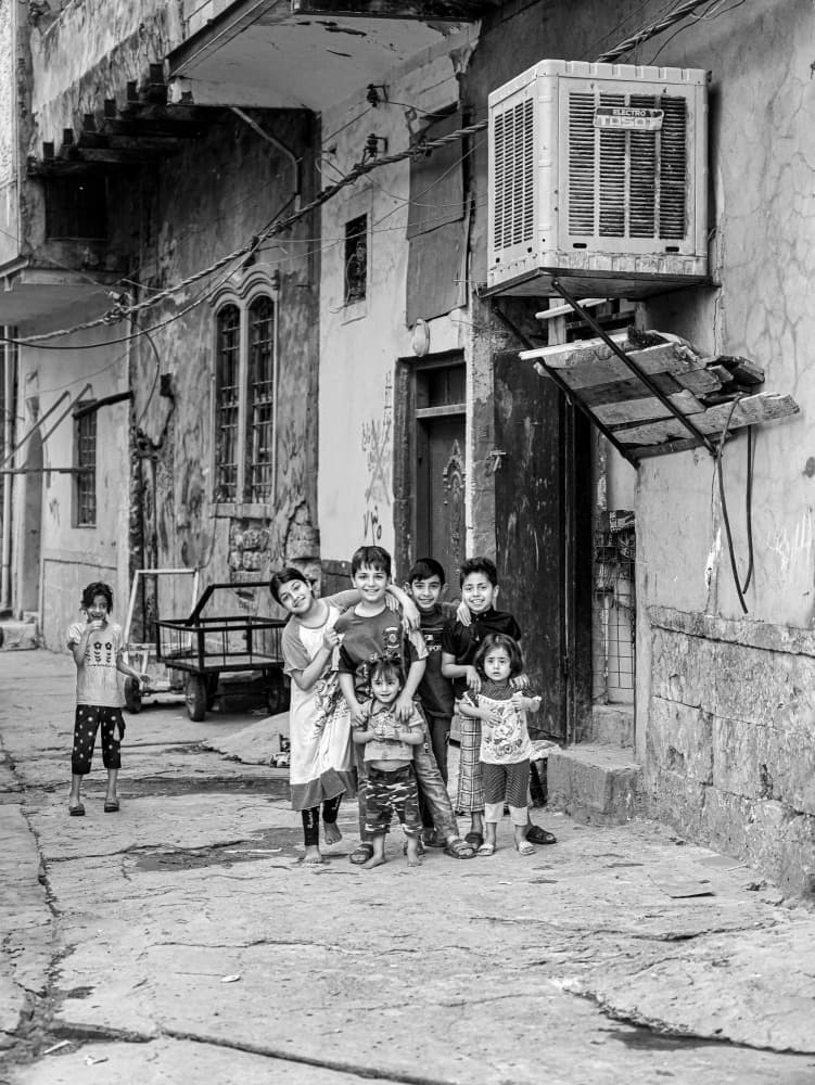 Smiling Street Kids by Bashar Alsofey — canvas wall art