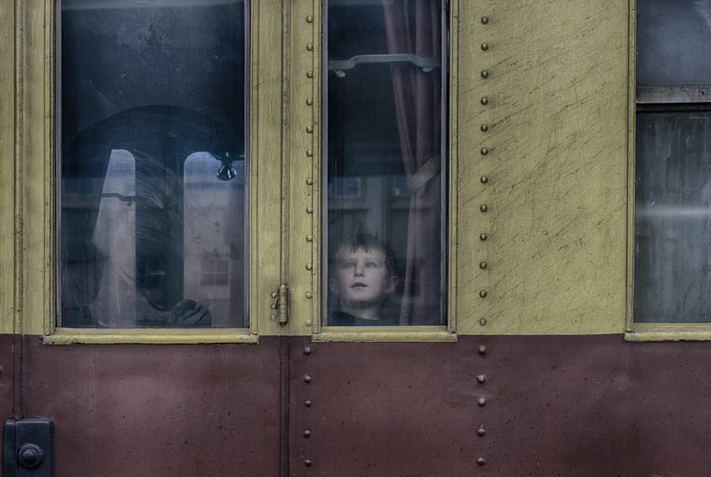 Curious Boy Train Window by Jani Novak — canvas wall art
