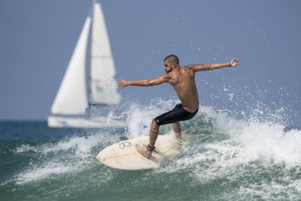 Surfer Rides Wave by Yuval — canvas wall art