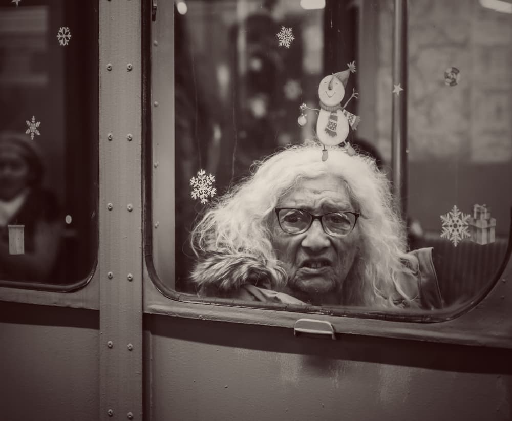 Elderly Woman Window Gaze by Tong Zhang — canvas wall art