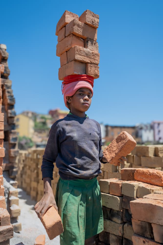 Child Carrying Bricks by Ilana Lam — canvas wall art