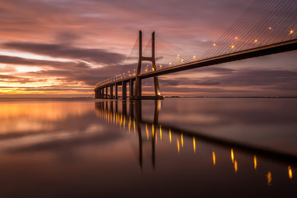 Reflected Bridge Sunset Glow by Ricardo Mateus — canvas wall art