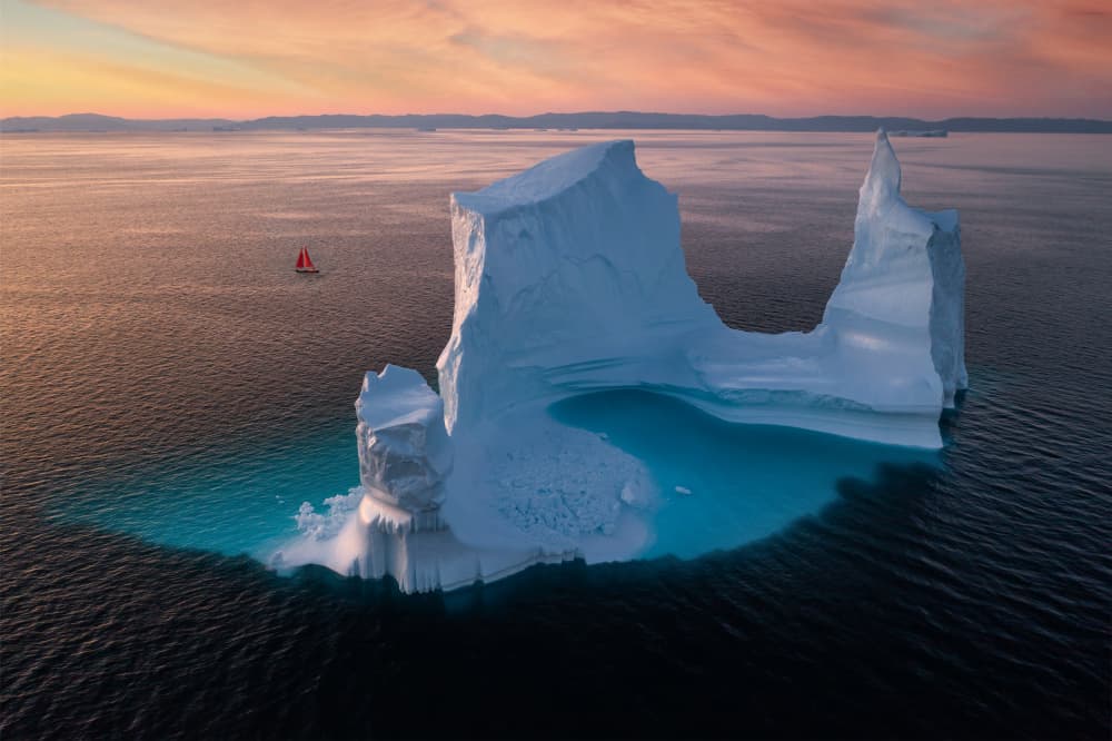 Arctic Iceberg Red Sailboat by Gerald Macua — canvas wall art