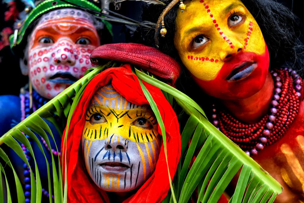 Vibrant Painted Faces by Avishek Das — canvas wall art