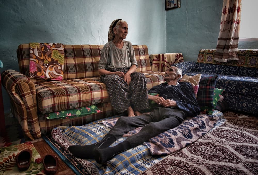 Elderly Couple Home by Ali Ayer — canvas wall art