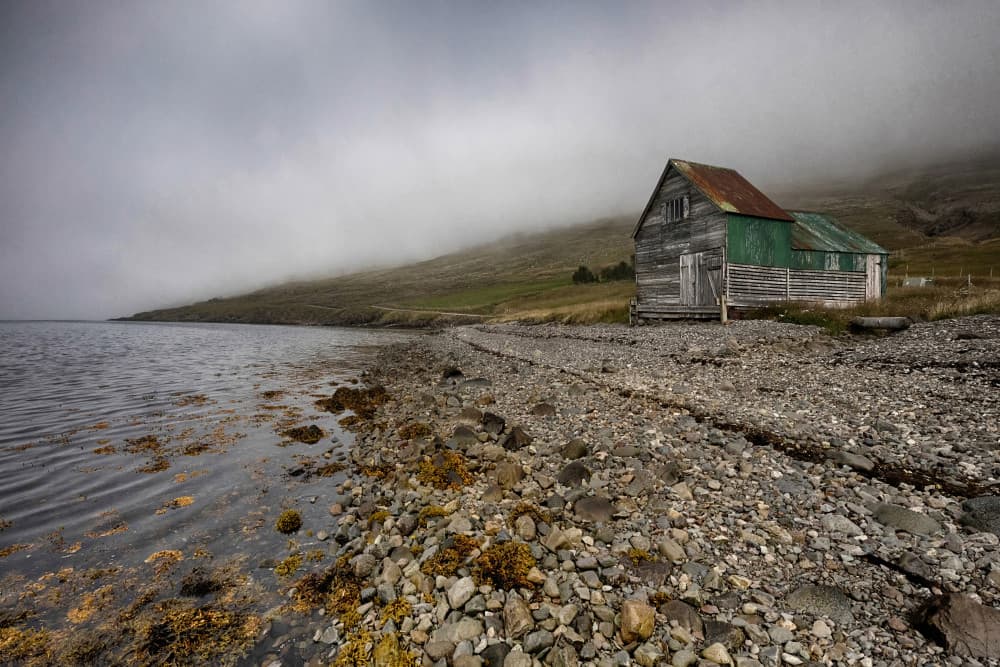 Misty Coastal Shack by Þorsteinn H. Ingibergsson — canvas wall art