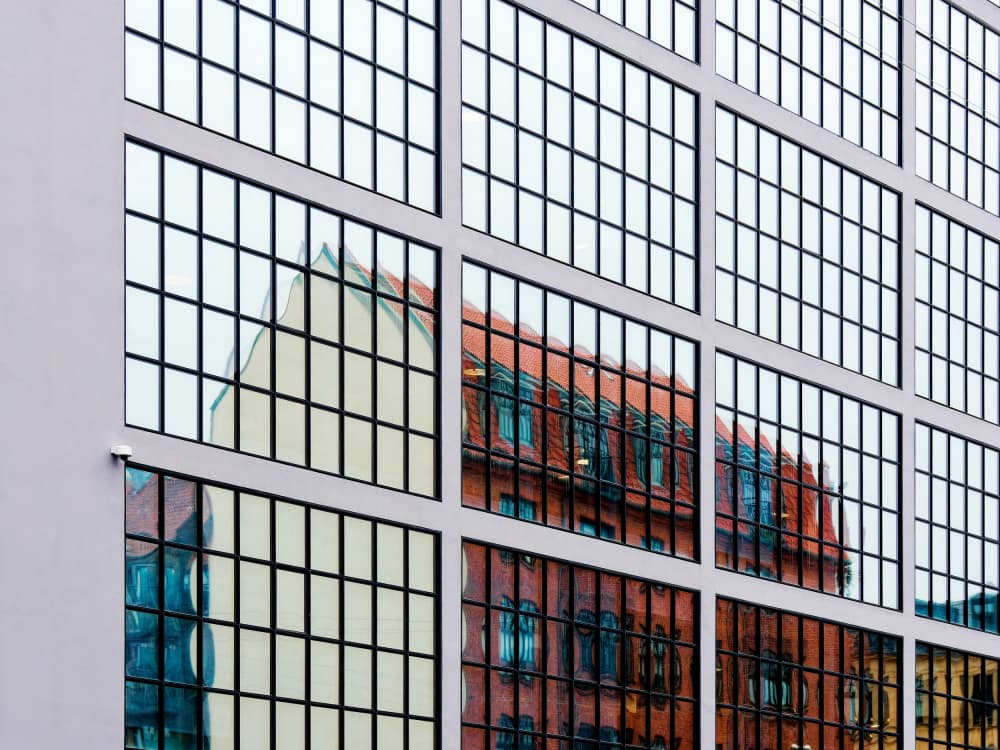 Geometric Building Reflections by Marius Surleac — canvas wall art
