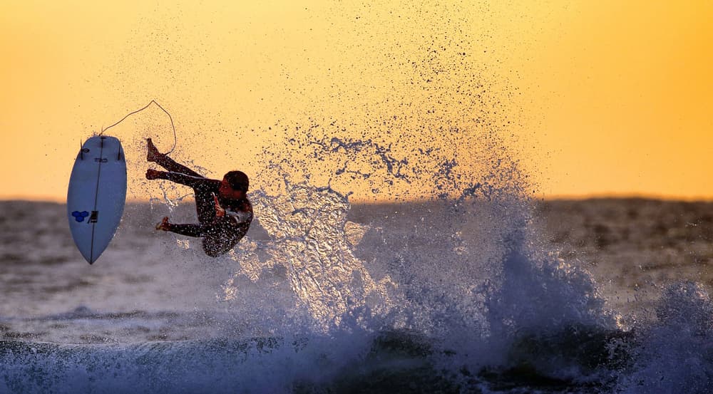 Airborne Surfer Sunset by Eyal Bussiba — canvas wall art