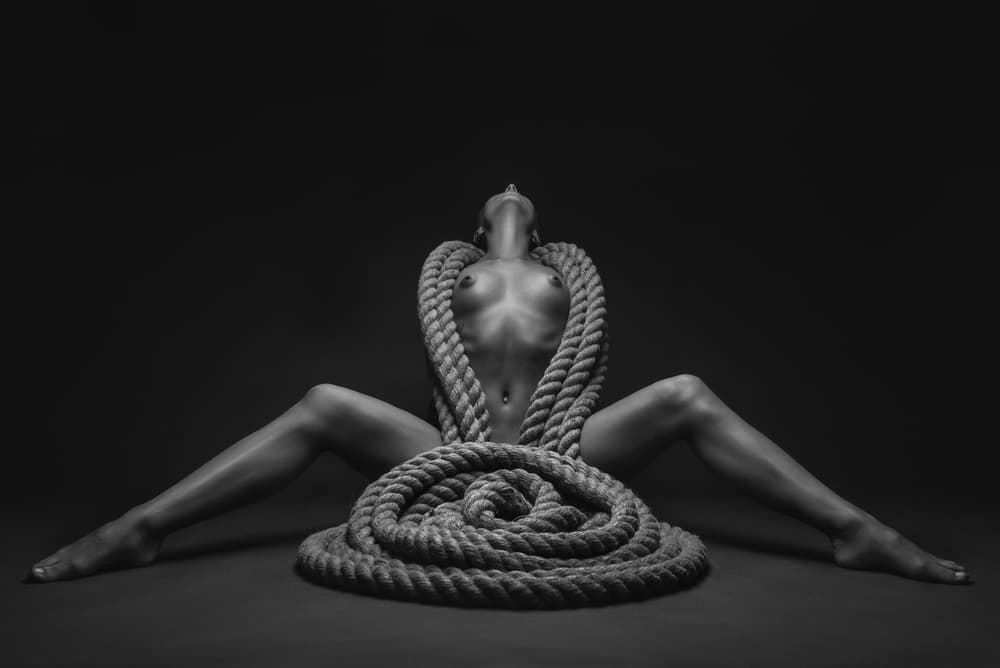 Woman and Rope Coil by AURIMAS VALEVICIUS — canvas wall art
