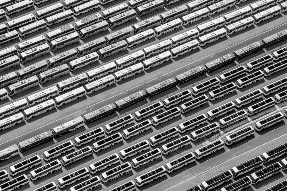 Rows of City Buses by Mohammed Bustani — canvas wall art