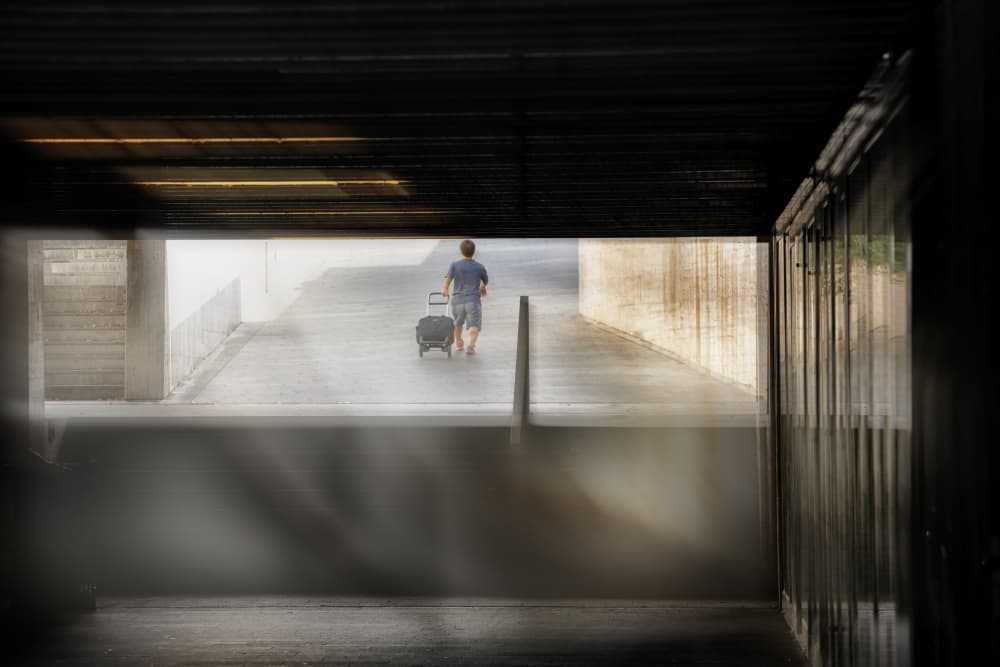 Man Walking Towards Light by Jurij Bizjak — canvas wall art