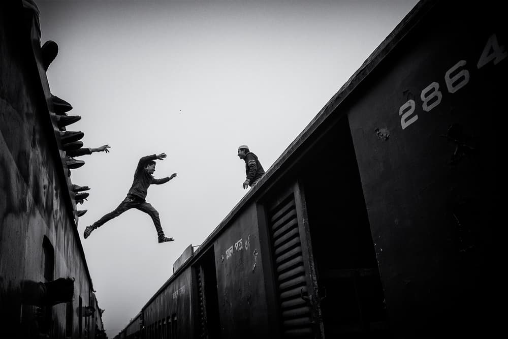Leap Between Trains by Marcel Rebro — canvas wall art