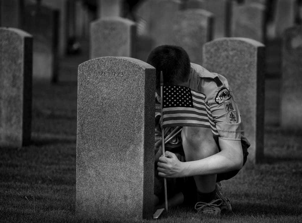 Boy Honors Military Grave by Dwayne Fortier — canvas wall art