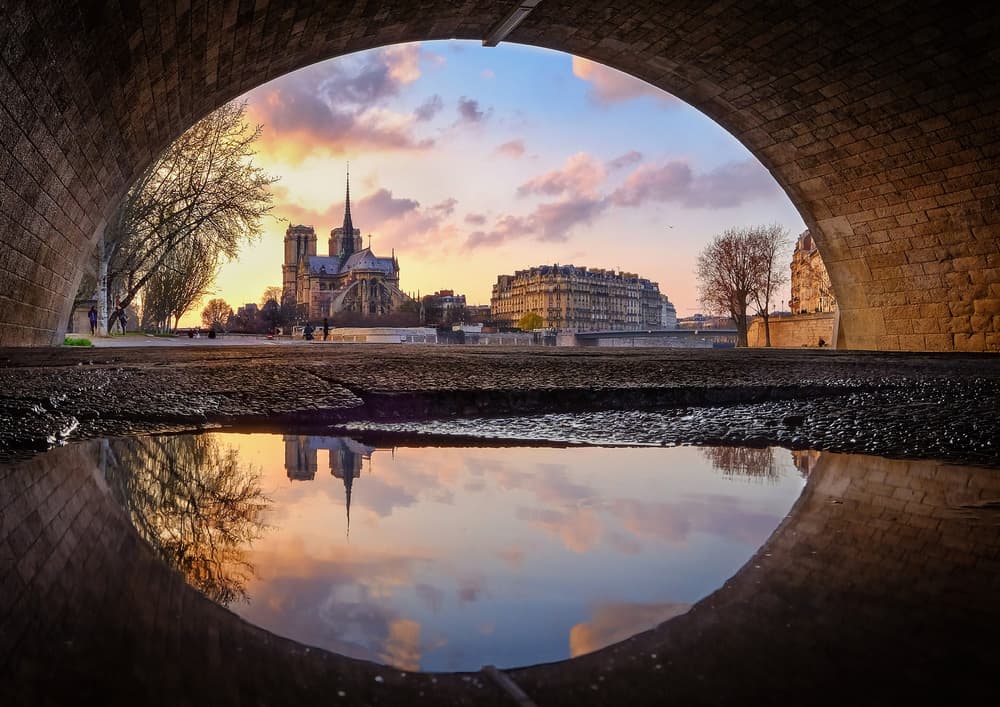 Notre Dame Sunset Reflection by Charly Lataste — canvas wall art