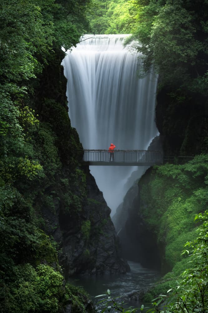 Red Jacket Waterfall View by Simoon — canvas wall art