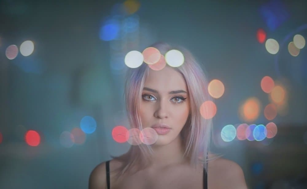 Pensive Woman City Glow by Cristian Andreescu — canvas wall art