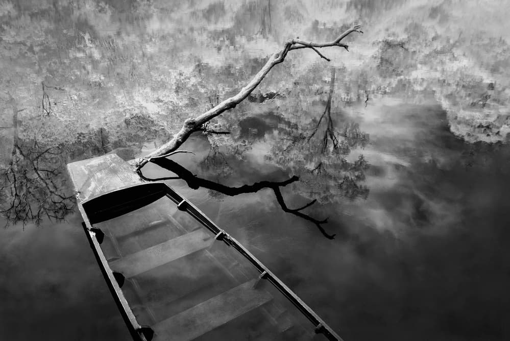 Solitary Boat Reflection by Ekkachai Khemkum — canvas wall art
