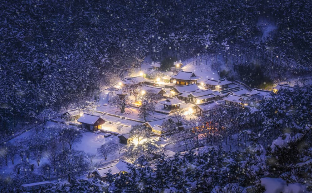 Snowy night at a mountain temple by Tiger Seo — canvas wall art