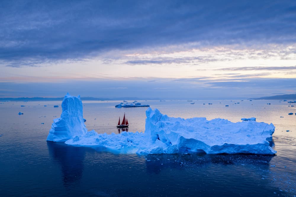 Red Sailboat Among Icebergs by Stefan Schilbe — canvas wall art