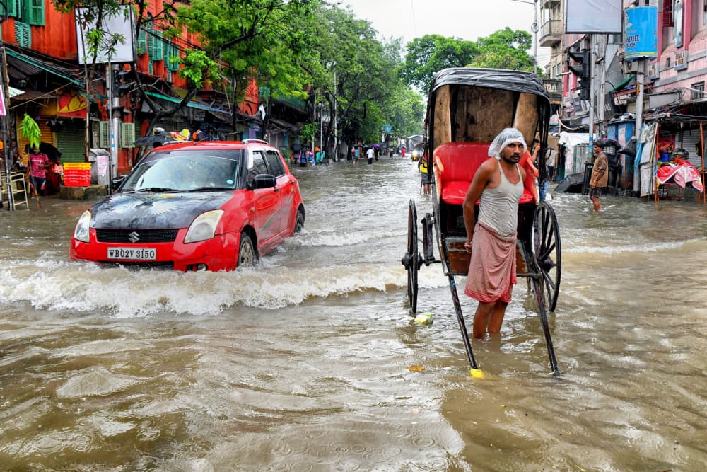 Monsoon City Street by Shaibal Nandi — canvas wall art
