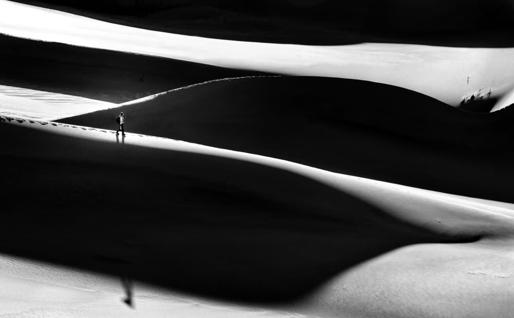 Lone Figure on Snow Dunes by Izidor Gasperlin — canvas wall art