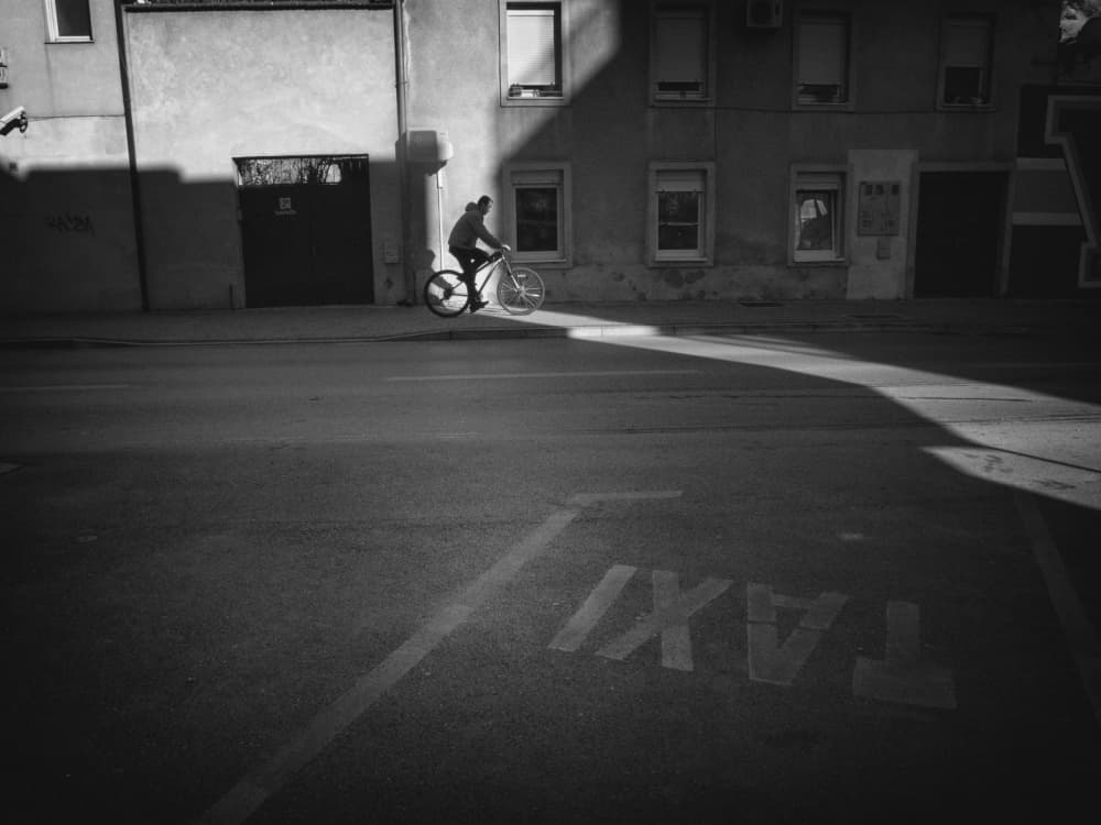 Urban Cyclist Shadow Play by Svetislav Cvetkovic — canvas wall art