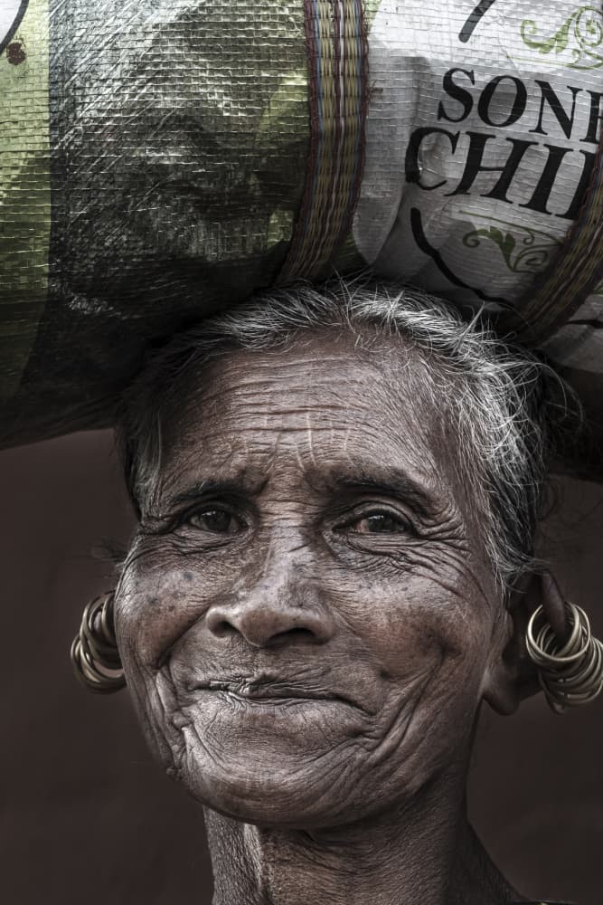 Smiling Elder With Headload by Elena Molina — canvas wall art