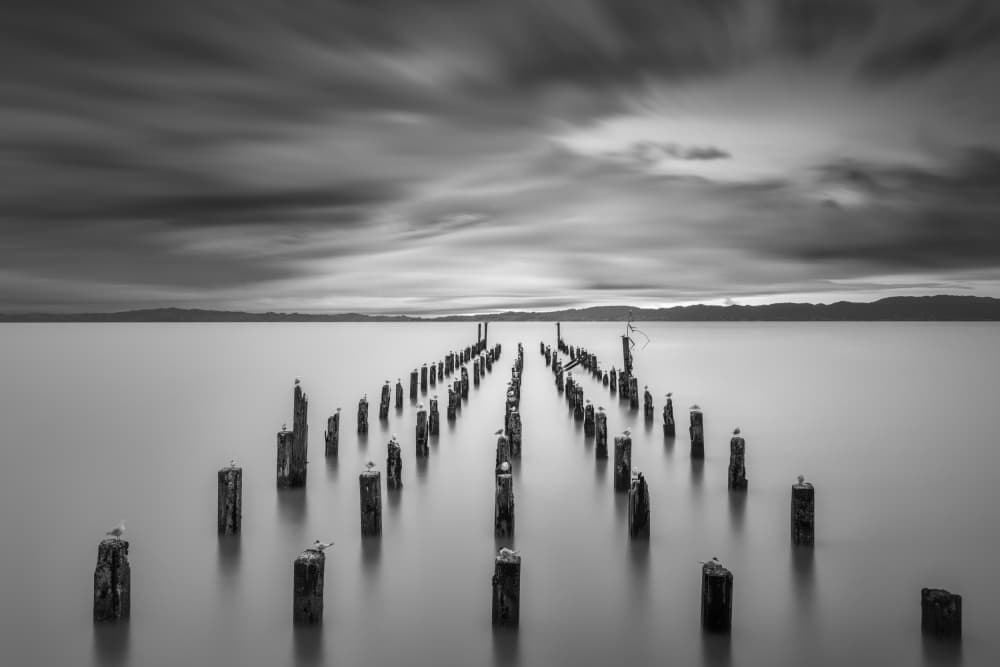 Moody Piers Seascape by Jana Luo — canvas wall art