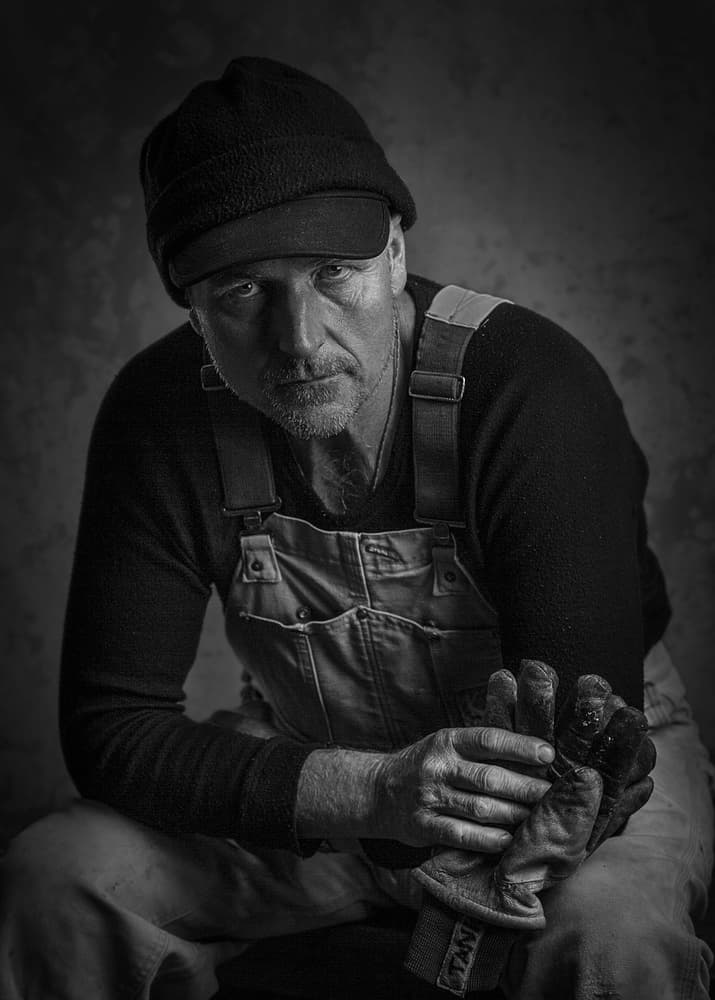 Pensive Blue-Collar Worker by David Leyland — canvas wall art
