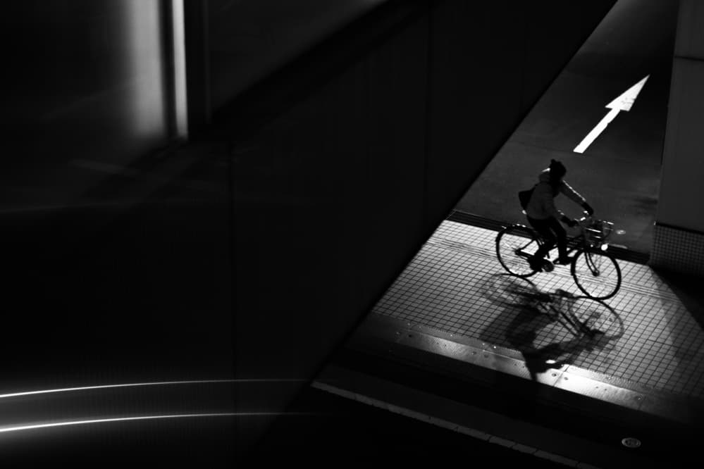 Urban Cyclist Silhouette by Satoshi Hata — canvas wall art