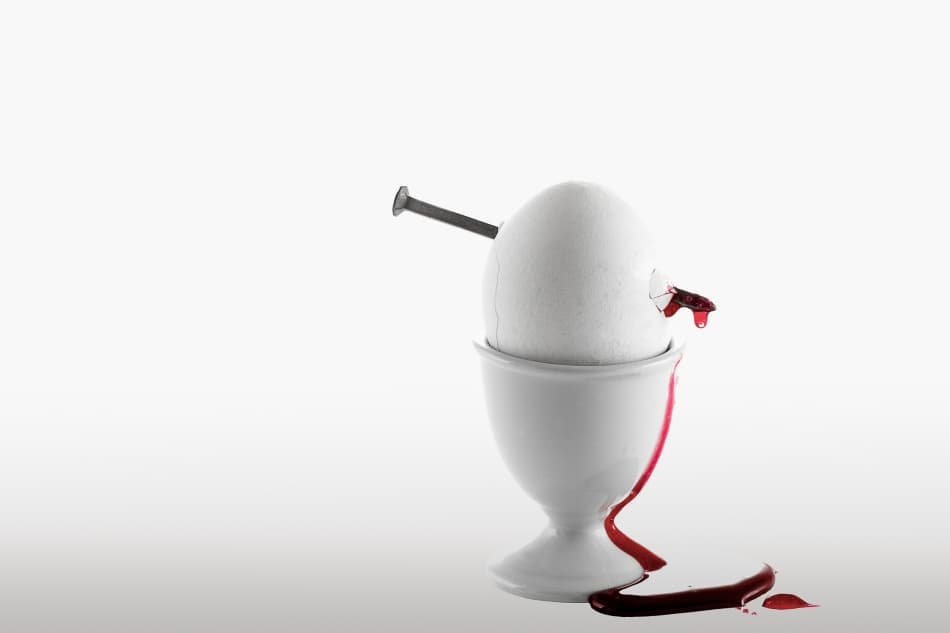 Nailed Egg Bleeds Red by Gert Lavsen — canvas wall art