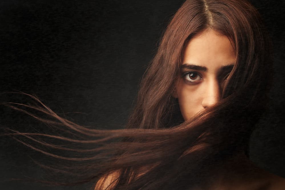 Woman's Dark Gaze by Mehdi Mokhtari — canvas wall art