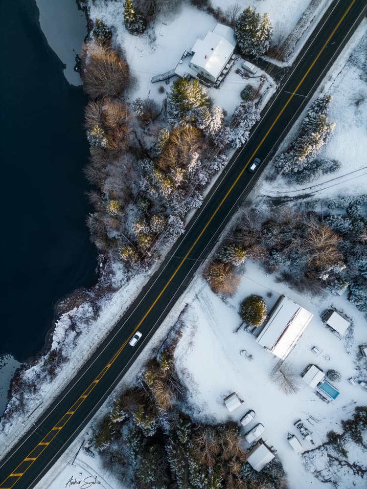 Snowy Winter Road by Ambar Saha — canvas wall art