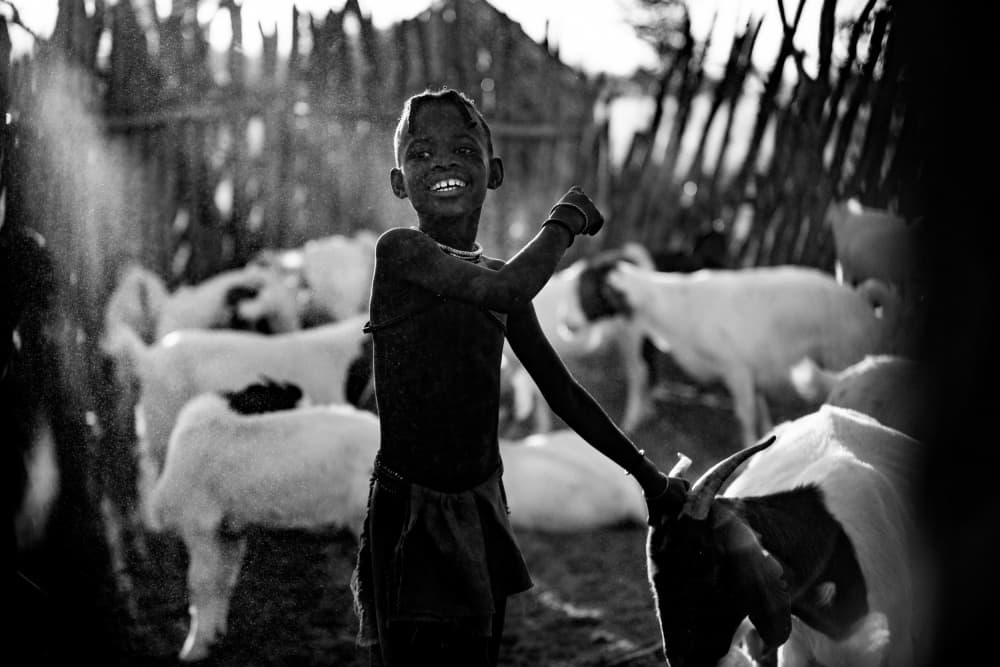Smiling Boy and Goat by Gina Buliga — canvas wall art