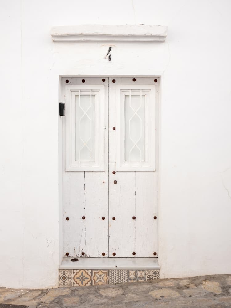The White Door in Vejer by Raisa Zwart — canvas wall art