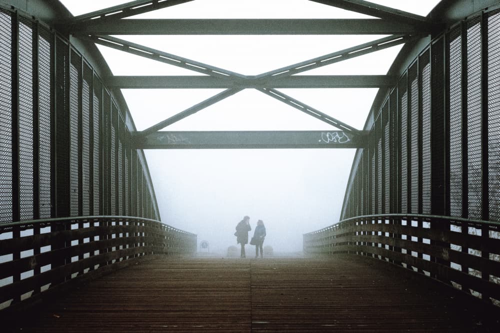 Figures on a Foggy Bridge by Pristine Clothes — canvas wall art