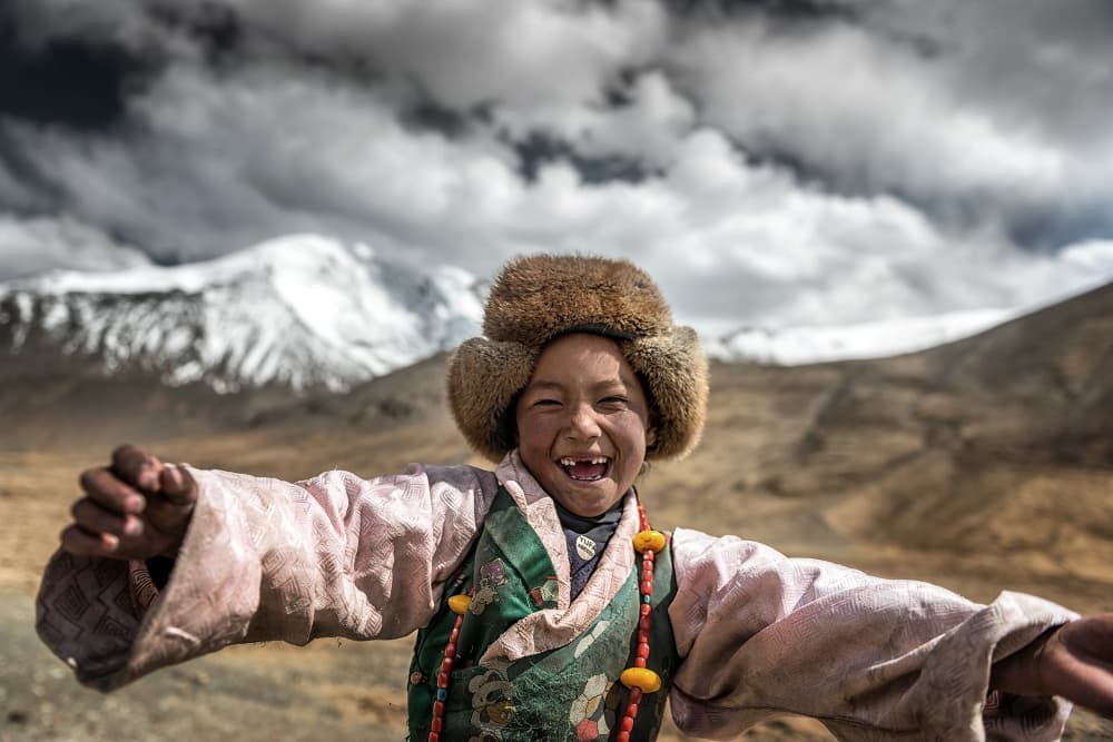 Joyful Mountain Child by Sarawut Intarob — canvas wall art